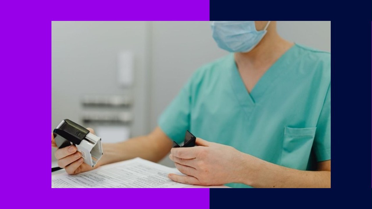 Medical professional with stamp, reviewing documents, key to understanding medical billing service costs.