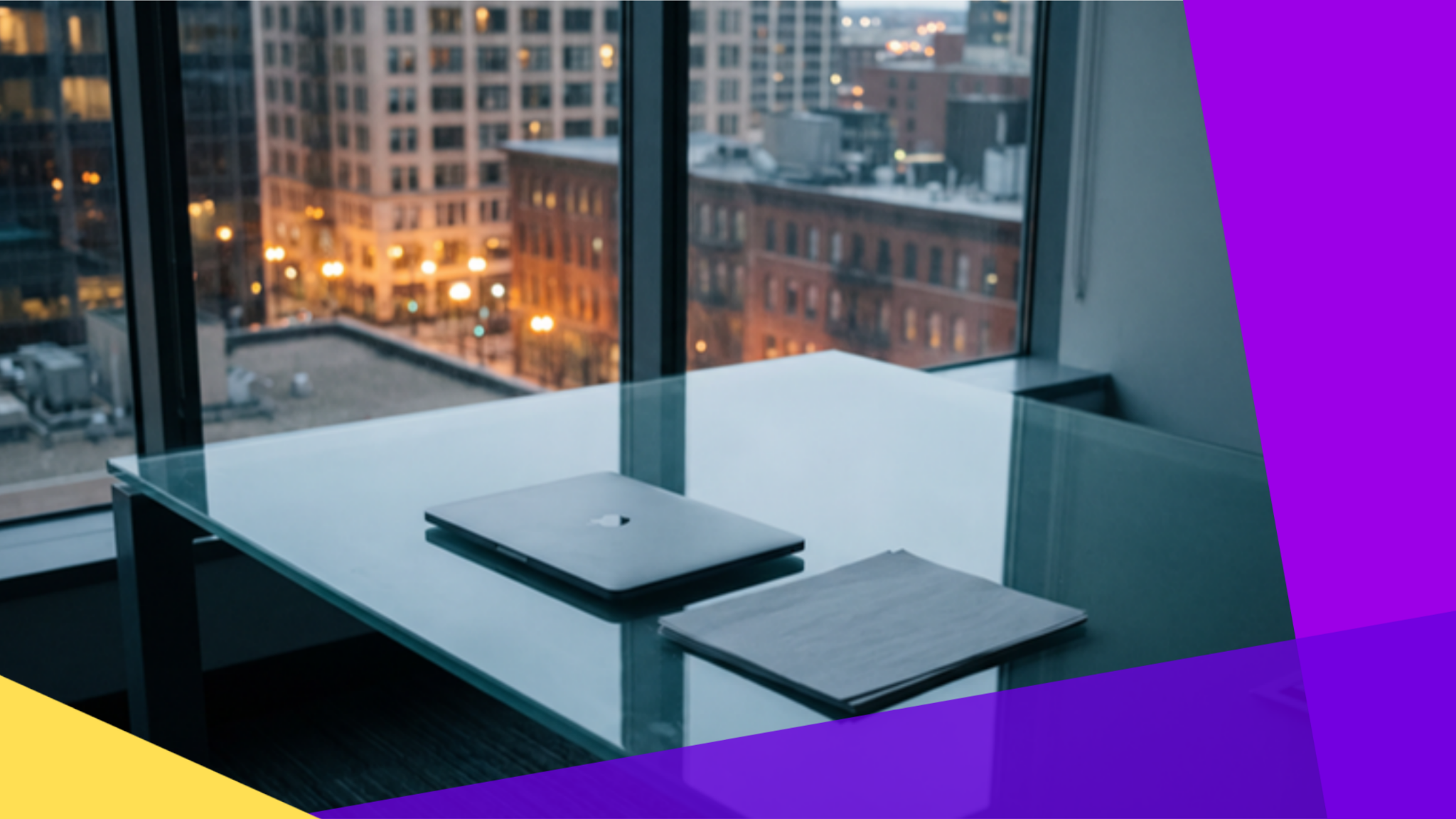 Empty modern boardroom at dusk with city skyline through glass windows