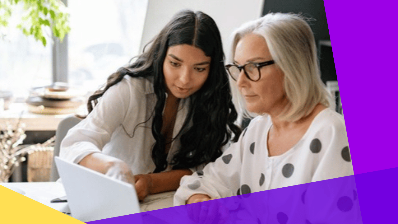 managed services vs staff augmentation - team lead reviewing work with a colleague on a laptop