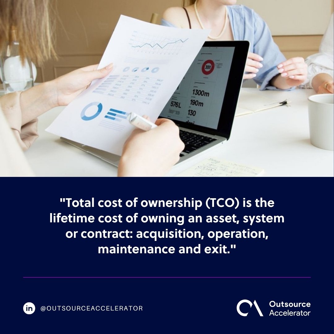 Total cost of ownership - a printed chart sheet held up against figures shown on a laptop in a meeting