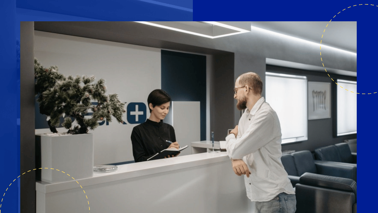 virtual patient check-in - patient talking with a receptionist at a clinic front desk
